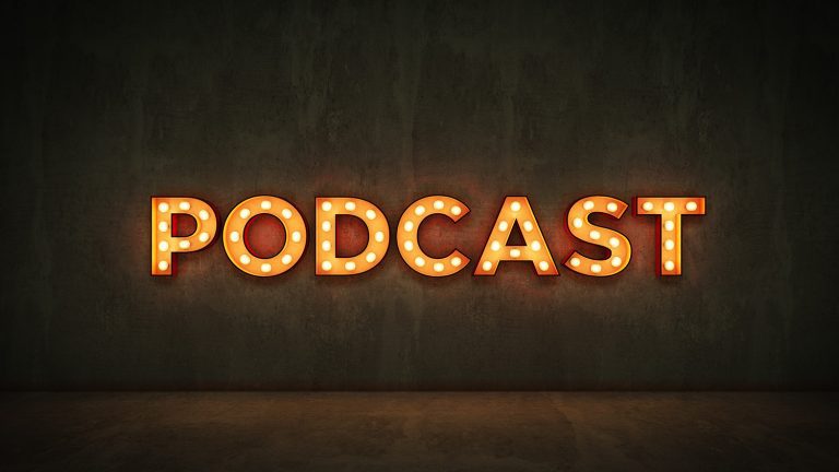 Custom Podcast Light Sign on Cement Wall with Orange Glow